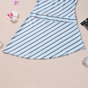 Detail of blue and brown diagonal striped dress hem with elegant accessories