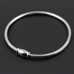 Close-up of a silver stainless steel snake chain bracelet with an olive-shaped metal clasp