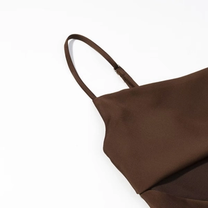Detailed view of dark brown satin top featuring fine twill texture and delicate thin straps