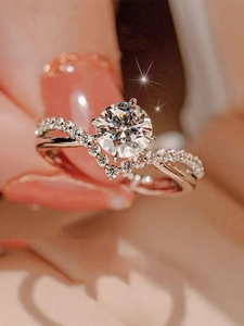Macro shot of 1 carat round zircon ring with crisscross pavé band and six-prong setting