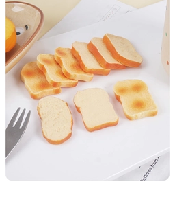 Macro view of eight mini PVC simulation toast slices with realistic baking texture on a plate