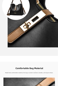 Close-up of black litchi texture leather with brown strap and gold metal lock detail