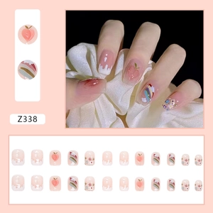 Detail of 24pcs pink peach press-on nails with 3D floral and rainbow patterns