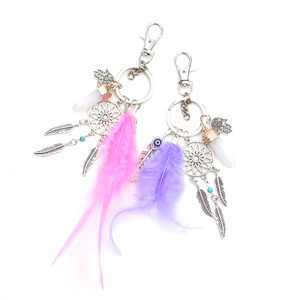 Pink and purple dreamcatcher feather keychains with Hamsa hand and Evil Eye charms