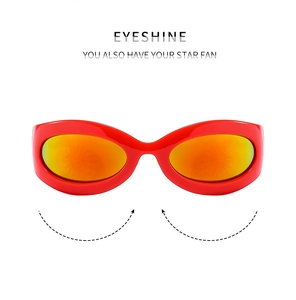Close-up of red futuristic Y2K sports sunglasses with orange mirrored lenses