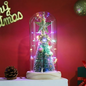 Macro shot of glass dome Christmas tree with colorful LED lights on wood base