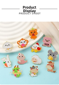 Flat lay of twelve colorful enamel animal pins featuring cute Chinese zodiac characters