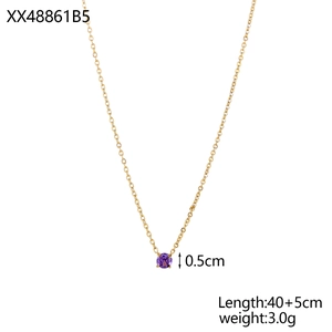 Detail of 40cm gold chain necklace featuring 0.5cm round purple gemstone in four-prong setting