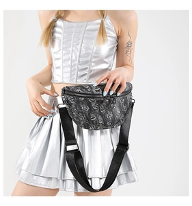 Detail of black skull print waist bag with silver chain and adjustable strap on model