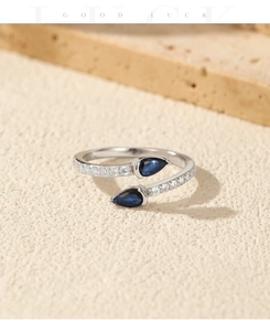 Close-up of S925 silver snake ring with blue teardrop stones and zircon inlay