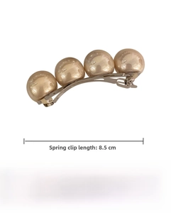 Detail of 8.5cm champagne pearl hair clip with alloy spring mechanism and four pearls
