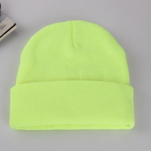 Close-up of the neon yellow ribbed knit texture on this warm winter beanie hat