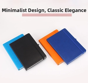 Detailed view of four colorful hardcover notebooks with elastic straps and textured faux leather