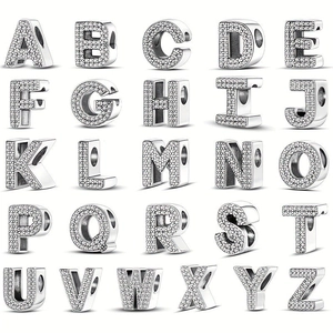Macro view of alphabet charms A-Z in silver finish with pavé set zircon stones