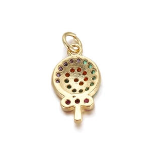 Macro shot of a 18K gold-plated tree pendant with colorful zircon stones for DIY jewelry