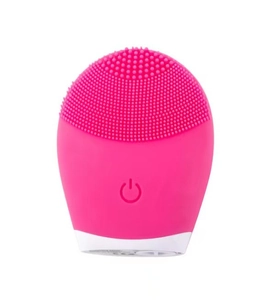 Detailed close-up of a pink silicone facial cleanser with soft massage bristles and power button