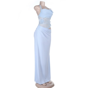 Detail of light blue evening dress set showing 3D floral applique on cropped top and long skirt