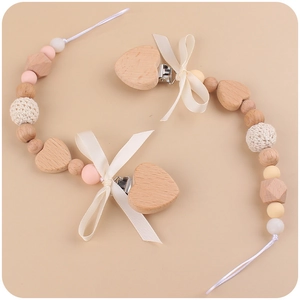 Handmade silicone and wood pacifier clips with bow and heart clip for baby teething