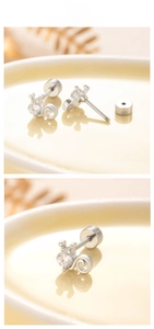 Macro view of crown-style screw back ear stud with a round clear zircon in silver finish