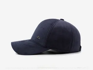 Detail view of navy herringbone winter baseball cap with side mountain metal logo