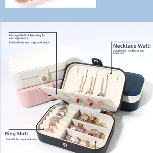 Internal layout of portable travel jewelry box with necklace hooks and ring slots