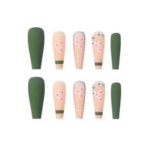Long coffin press-on nails in matte green and pink with cherry blossom and rhinestone
