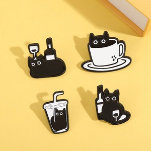 Cartoon black cat enamel pin set featuring cute cats in cups and bottles on yellow background