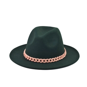Detailed view of the dark green wool fedora with a pink matte chain decoration