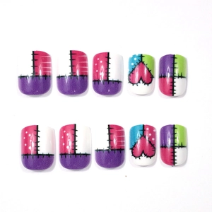 Detail of 10-piece short square press-on nails with stitched heart and geometric patterns