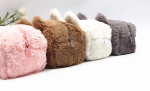 Detailed view of plush animal pencil cases in pink brown white and grey with rabbit ears