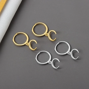 Luxury gold and silver crescent moon hoop earrings with polished geometric charms