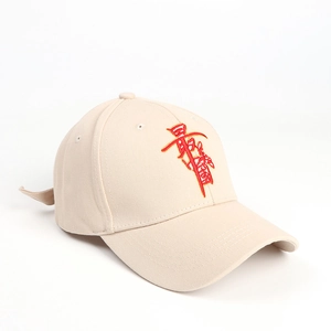 Detail of beige baseball cap featuring high-quality red embroidered Chinese text