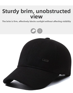 Detail of black winter baseball cap showing textured fabric and metal logo plate