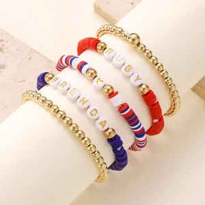 Detail view of American Independence Day layered bracelets with custom letter beads