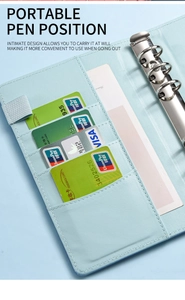 Detail view of A6 binder interior with card slots, pen loop and 6-ring binder mechanism