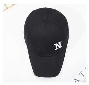Detailed top view of black cotton baseball cap with white 3D embroidered N letter