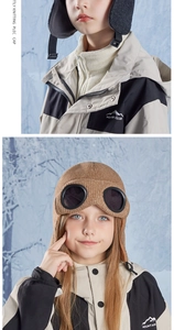 Close-up of children's winter pilot hat with thermal fleece lining and goggles