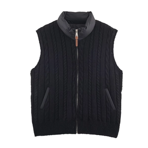 Detail of black cable knit vest with quilted stand collar and metallic zipper puller