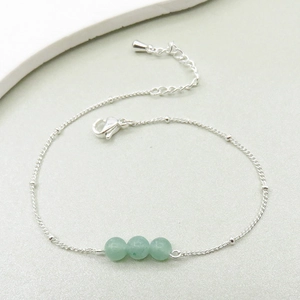 Detail of green stone beads and adjustable 925 silver plated chain with lobster clasp