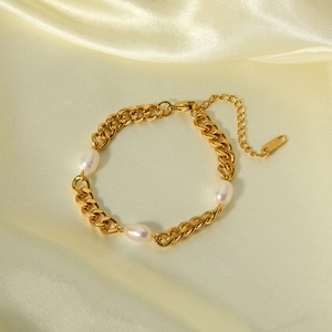 Detail shot of 18K gold plated chain bracelet with natural freshwater pearls on silk