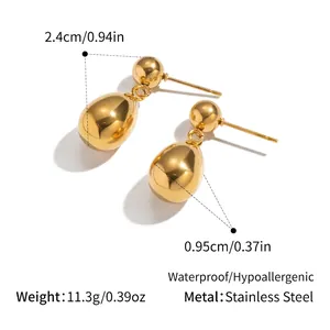 Detail of gold teardrop earrings in stainless steel with 2.4cm length and 0.95cm width