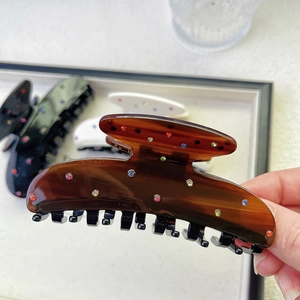 Elegant amber acetate hair claw clip with colorful rhinestones for women's hair styling