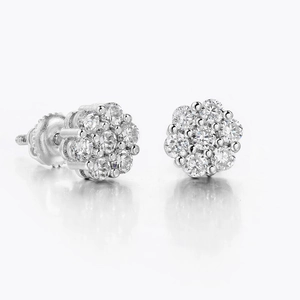 Macro shot of sparkling flower stud earrings with full diamond inlay and screw back design