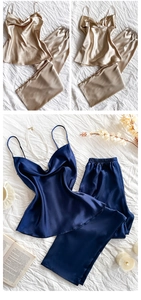 Detail of silk-like satin pajama set showing champagne gold and navy blue textures