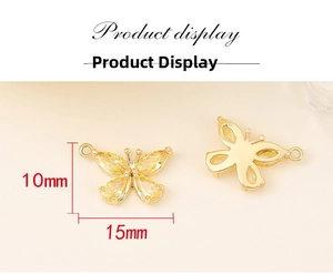 Detailed macro view of gold butterfly pendant with yellow zircon showing 15x10mm dimensions