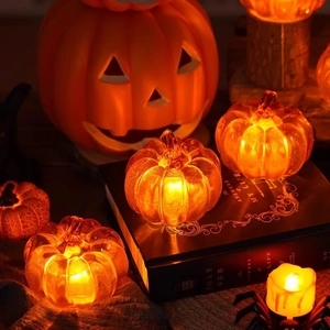 Halloween LED pumpkin lanterns set with warm orange light for festive table decoration
