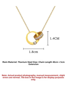 Detail of gold double ring pendant necklace with cubic zirconia and titanium steel chain