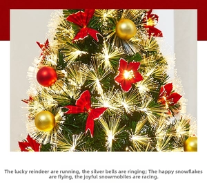 Close-up of fiber optic Christmas tree with red bows and colorful ornaments glowing