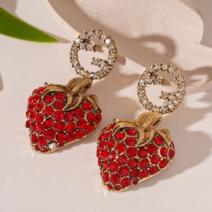 Vintage gold G-letter strawberry earrings with red rhinestones and silver needles