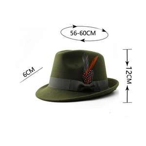 Detailed view of green wool felt fedora featuring grey ribbon bow and feather accent